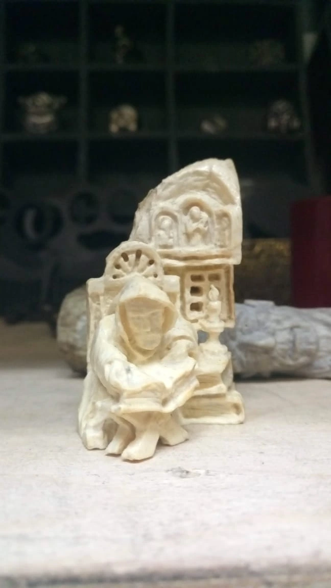 Mammoth-tusk figurine of a monk, full view
